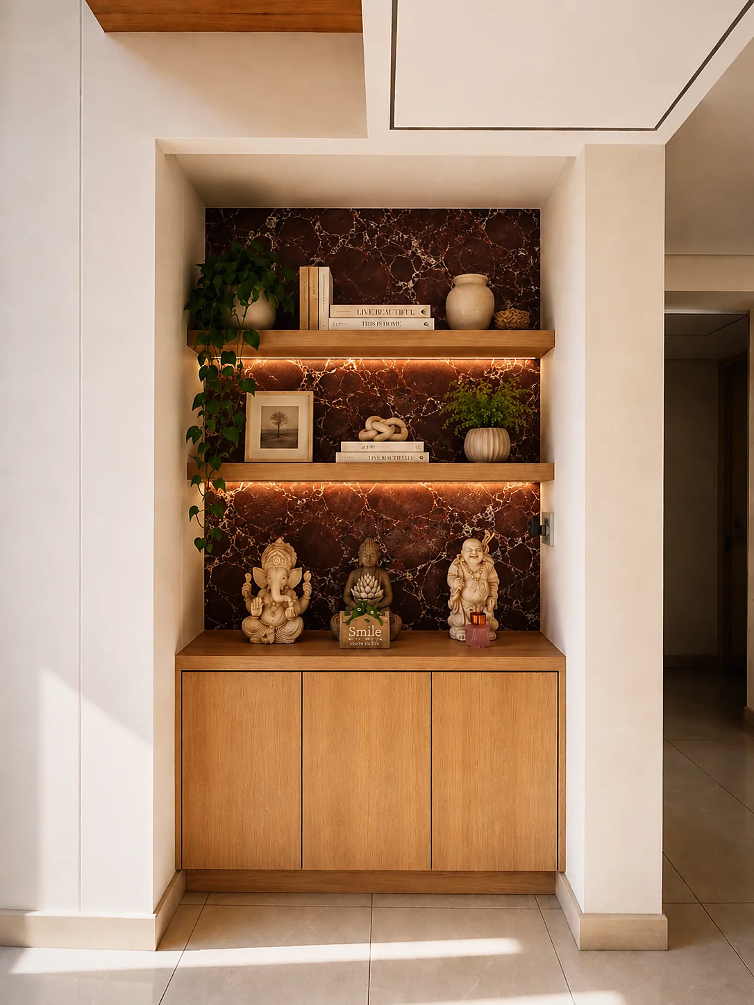 Recessed niche with dark veined stone, oak cabinetry and warm light beneath each shelf